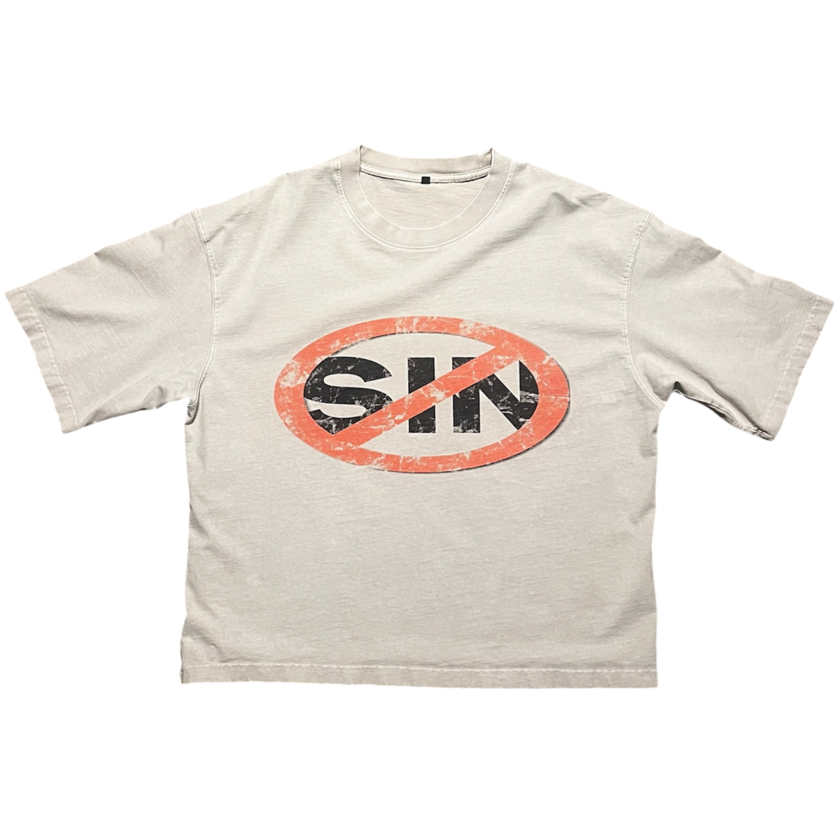 A light beige crewneck t-shirt featuring a distressed graphic on the chest of the word 'SIN' in black inside an orange oval, crossed out with a red prohibition symbol.
